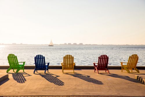 Adirondack chairs on the bay